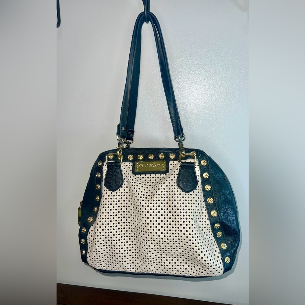 Betsey Johnson handbag, black and white perforated designgold-toned stud accents